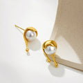 Molten pearl earrings, flat lay on white