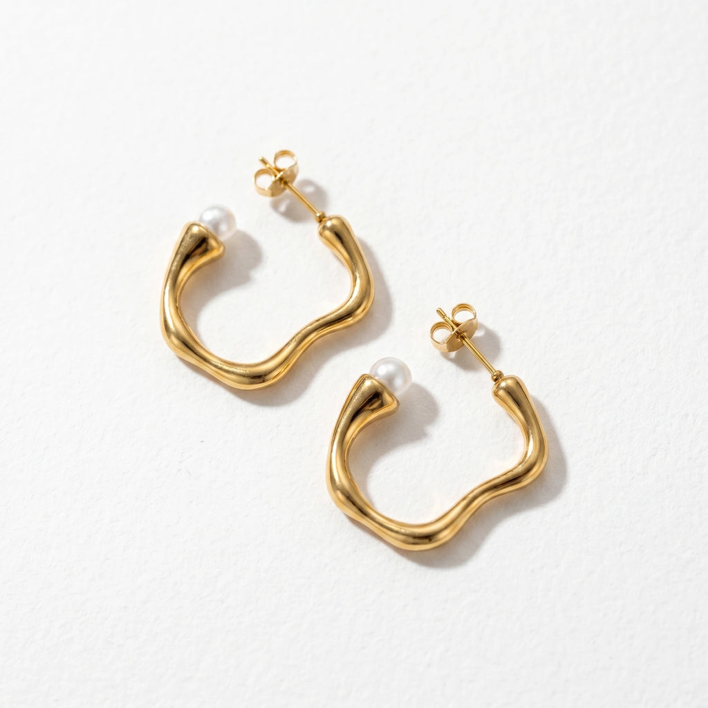 Molten Wave Pearl Hoops, gold, flat lay