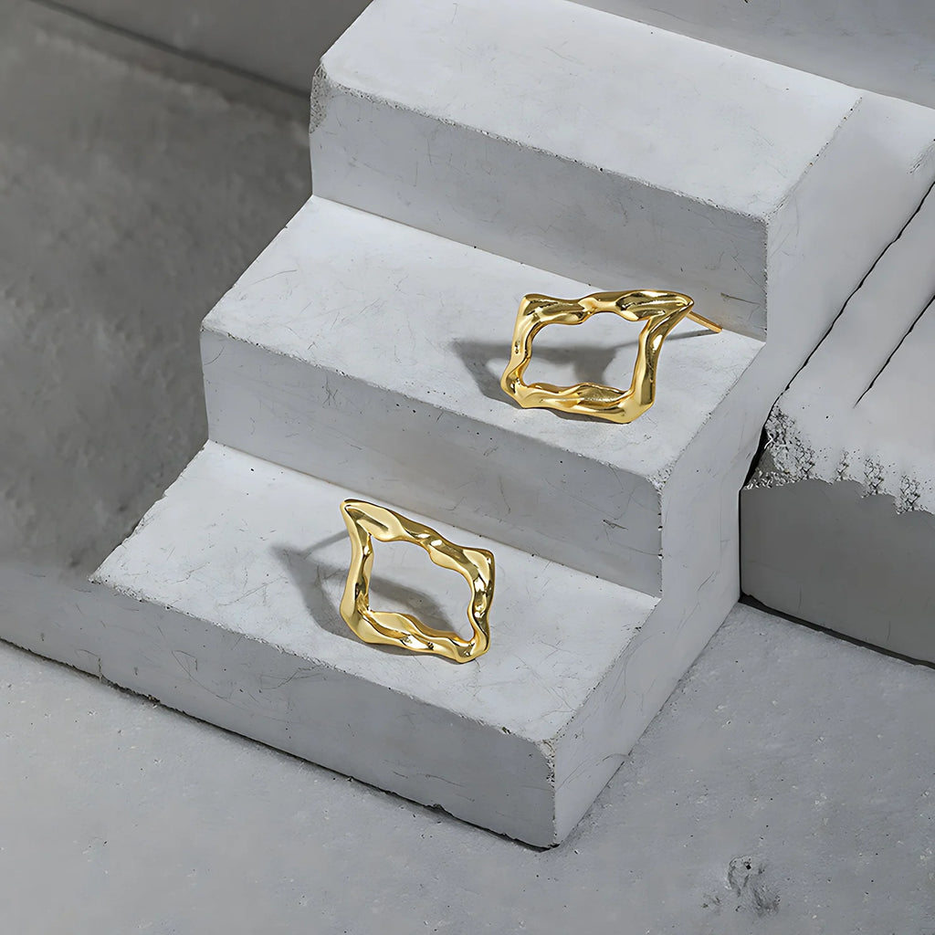 Molten Diamond Hoops, gold, product shot on concrete steps
