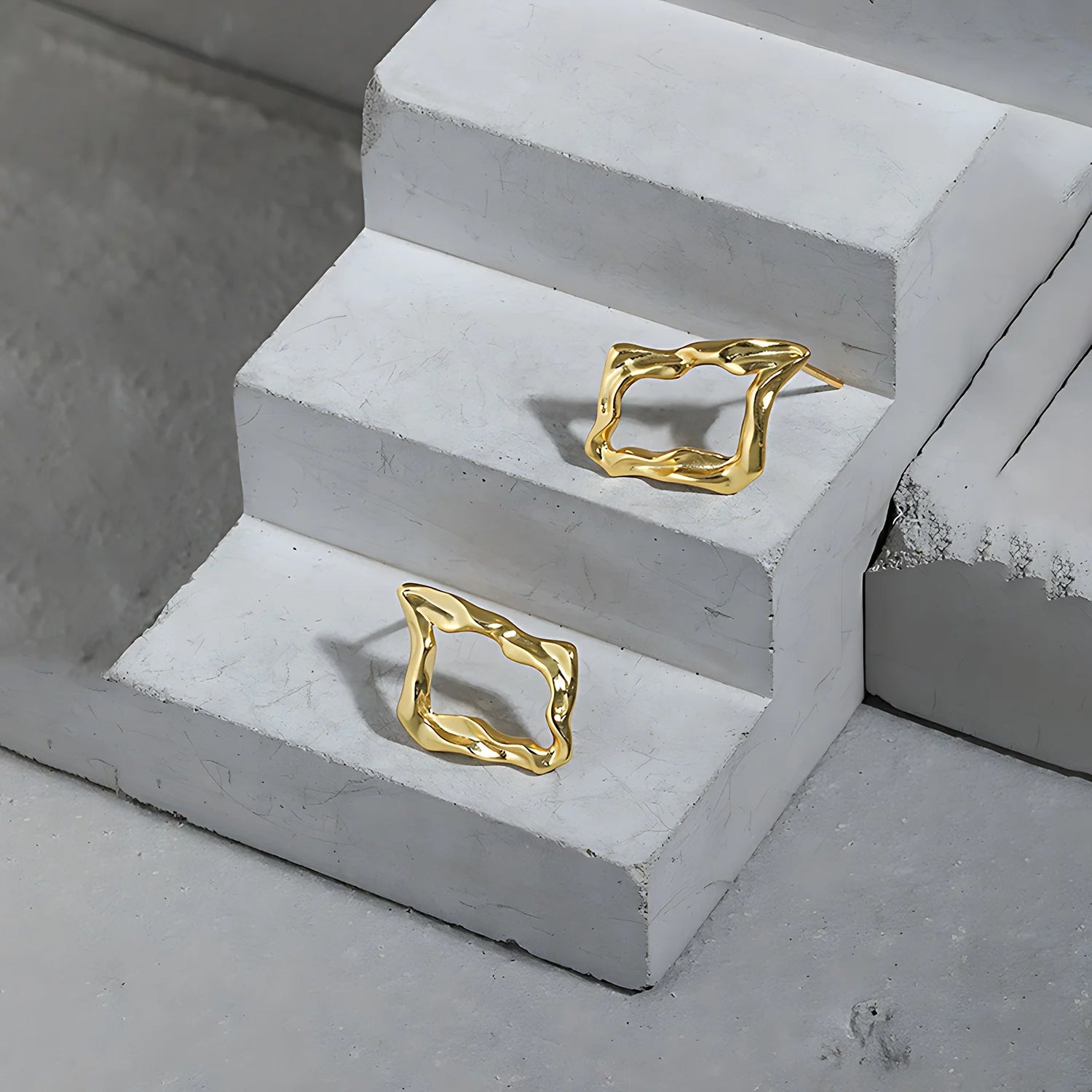 Molten Diamond Hoops, gold, product shot on concrete steps