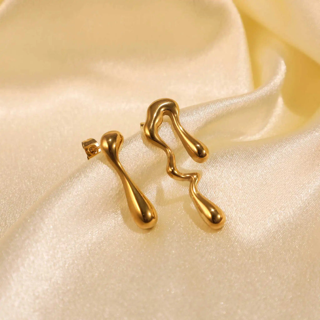 Molten drip earrings, mismatched pair, close-up