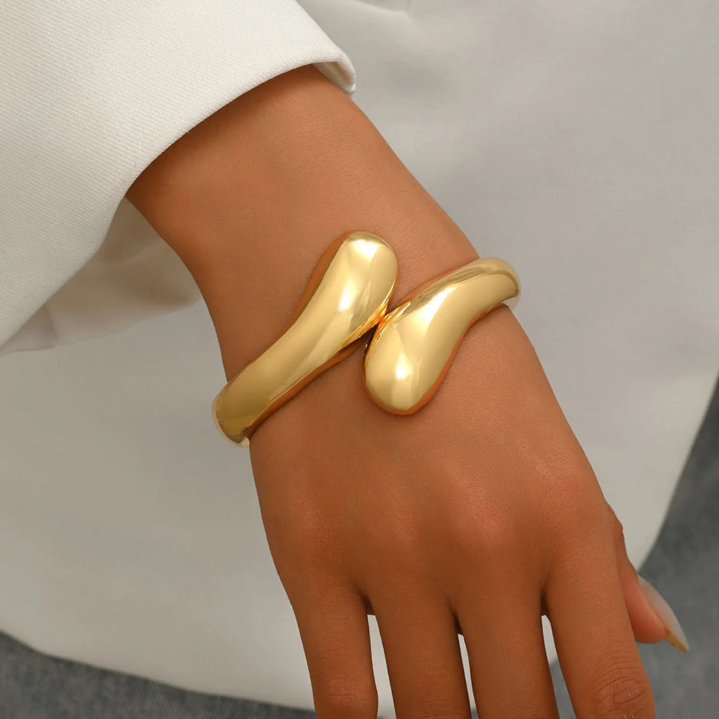 Molten Bypass Cuff, gold, worn on wrist