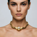 Molten pearl collar necklace worn on neck