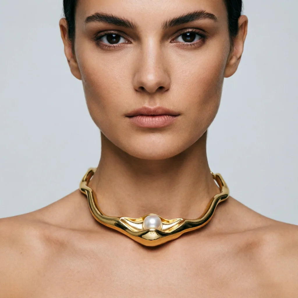 Molten pearl collar necklace worn on neck