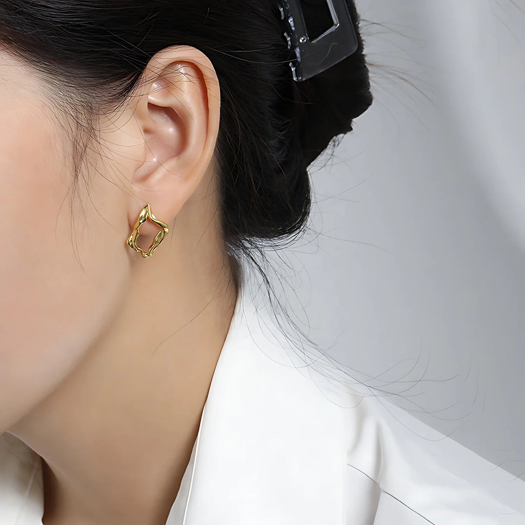 Molten Diamond Hoops, gold, worn on ear