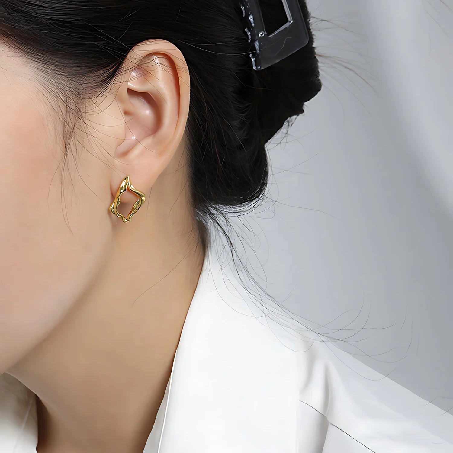 Molten Diamond Hoops, gold, worn on ear